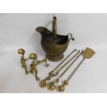 A pair of brass fire dogs, a coal bucket & a compa