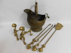 A pair of brass fire dogs, a coal bucket & a compa