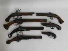 Seven reproduction flintlock & similar pistols