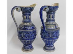 Two c.1900 German stoneware ewers, one with restor