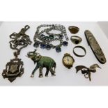 A silver medallion, a silver bow brooch, a Roamer watch case & other items