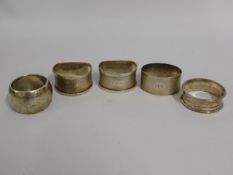 A pair of silver napkin rings, monogrammed twinned