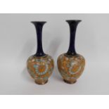 A pair of Royal Doulton stoneware vases, 9.75in ta