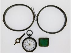 Two silver bangles, one small silver pocket watch