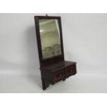 A 19thC. mahogany wall mounted mirror with drawers