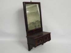 A 19thC. mahogany wall mounted mirror with drawers