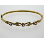 A 9ct gold bangle set with diamond & amethyst, 61m