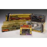 Four boxed diecast model vehicles