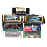 Seven boxed 1/18 scale diecast model vehicles