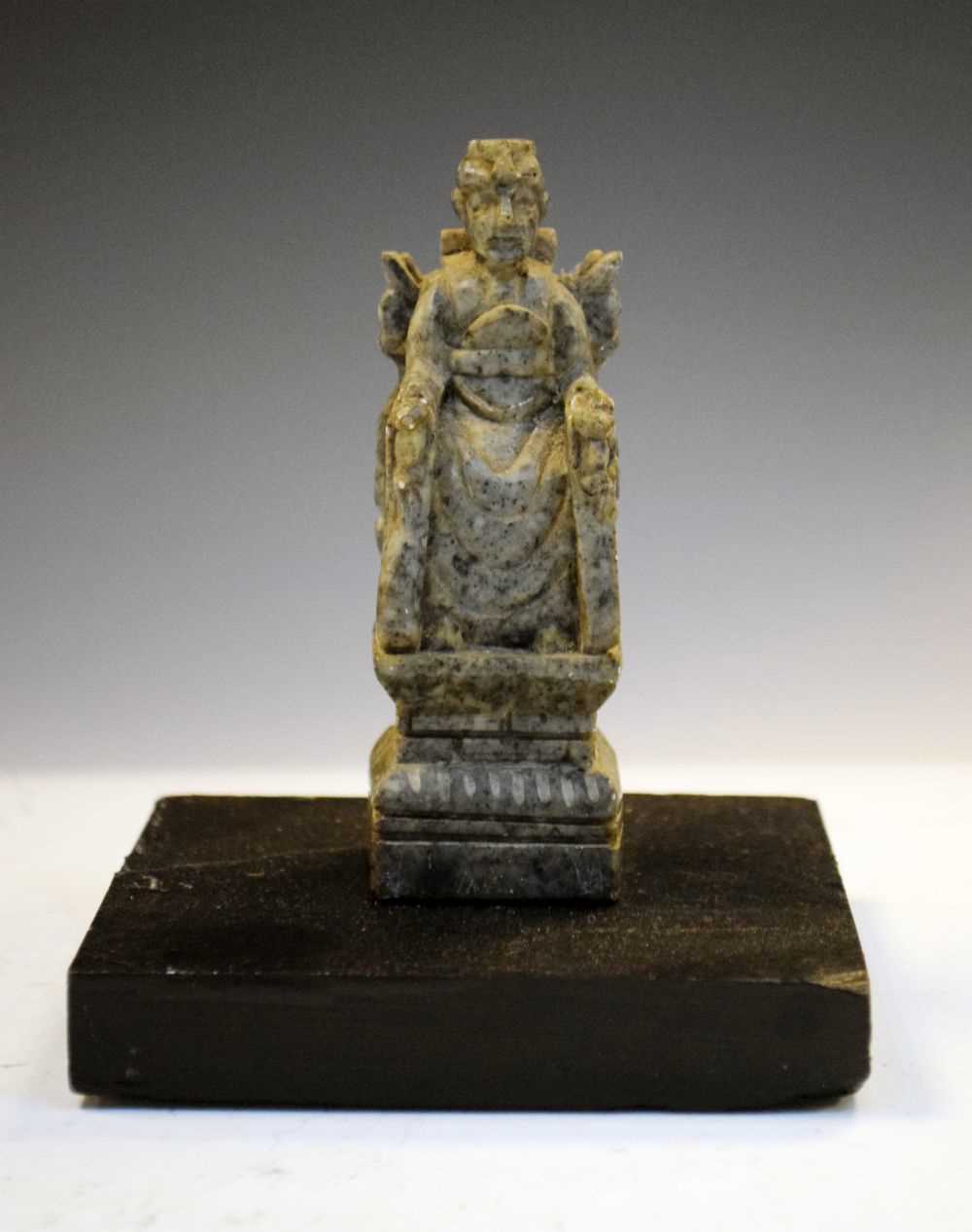 Carved soapstone seated figure