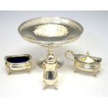 George V silver pedestal dish together with an Elizabeth II three-piece condiment set