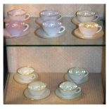 French 1950s opaline glass cups and saucers