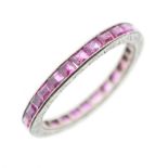 Unmarked white metal and ruby eternity ring