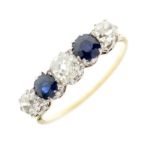 Unmarked yellow metal, diamond and sapphire five-stone eternity ring