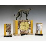 French Art Deco onyx, marble and patinated metal clock garniture