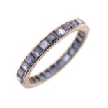 Unmarked white metal and sapphire eternity ring