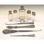 Quantity of silver topped glass jars, silver handled requisites, etc