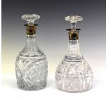 Two silver collared cut glass decanters