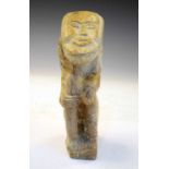 Primitive seated figure