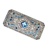 White metal panel brooch, set blue and white stones