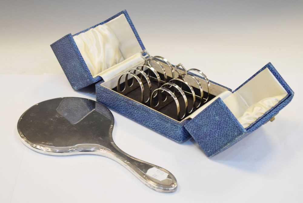 Cased pair of George VI silver toast racks together with a George V silver-backed mirror
