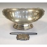 Silver pedestal dish and 'Rum' decanter label