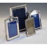 Four assorted silver easel photograph frames