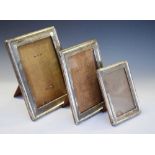 Three assorted silver easel photograph frames