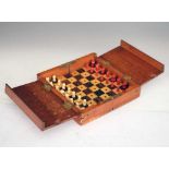 20th Century mahogany cased travelling chess set