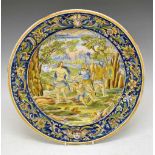 Large Italian maiolica charger with central painted decoration of soldiers resting