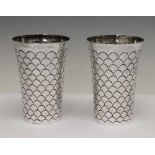 Pair of Victorian silver beakers of tapering form with fish-scale decoration