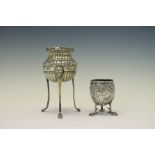 Late 19th Century Continental cast silver egg cup together with a white-metal pedestal salt