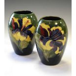 Moorcroft - Pair of Hibiscus pattern green ground ovoid vases