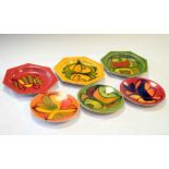 Six Poole pottery heptagonal plates