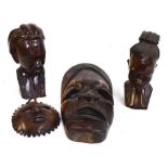 Two African hardwood busts, together with two wall masks