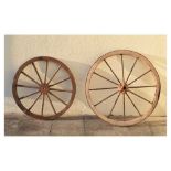 Two vintage wooden cartwheels