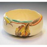 Clarice Cliff bowl with moulded autumn leaves against a cream ground