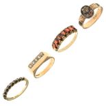 Four assorted 9ct gold and yellow metal dress rings