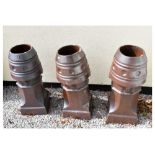 Three glazed terracotta chimney pots