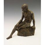 Bronzed resin seated male nude