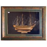 Framed model of HMS Victory, with a piece of oak purportedly salvaged from HMS Victory