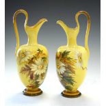 Pair of Doulton Faience ewers floral decoration on yellow ground