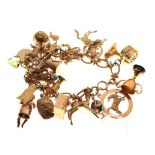 9ct gold charm bracelet, attached various charms