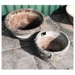 Two circular composite stone garden planters