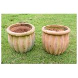 Two terracotta finish garden planters