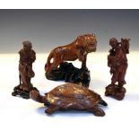 Four Chinese wooden sculptures to include a tortoise, etc.