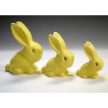 Three graduated lemon yellow glaze rabbits largest marked 990