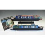 Two model narrow boats and Puffin book