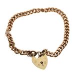 9ct gold curb-link bracelet with 9ct gold heart-shaped padlock