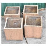 Set of four square 'stoneware' log effect garden planters